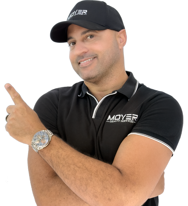 James Moyer Tucson Realtor pointing with smile in branded shirt and hat